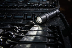 LED Flashlight Turned On Laying on Tool Box, lifestyle photo